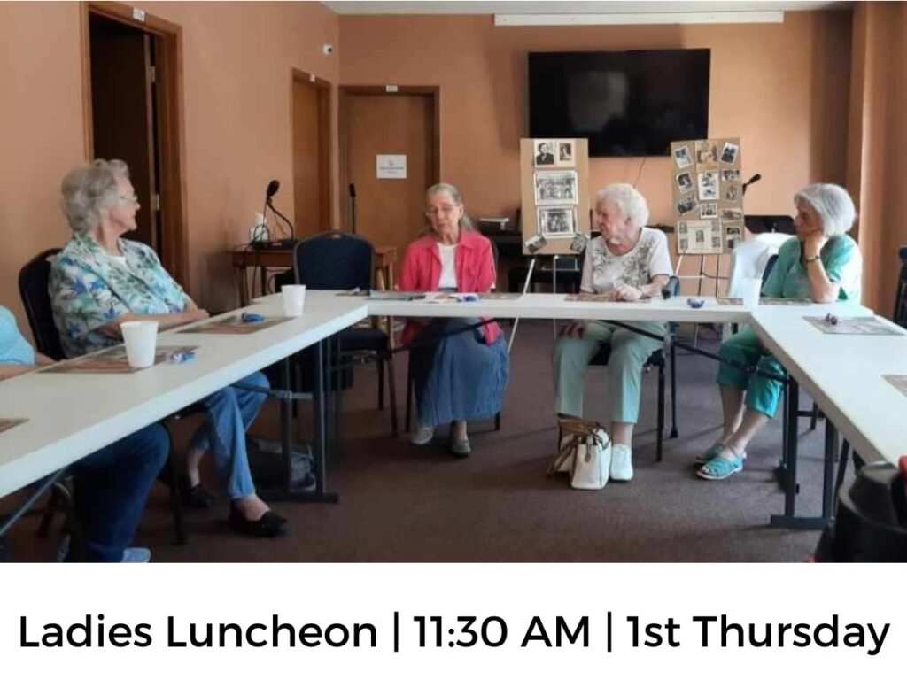 women sitting around a table talking